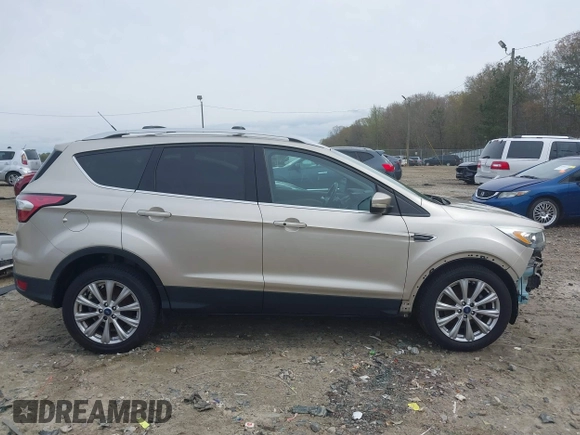 2017 Ford Escape Titanium with VIN 1FMCU0JD2HUC30884, listed as a IAAI auction lot 41801272 with 111,644 mi miles. Bid and sale history available at carsss.com. Image 14.
