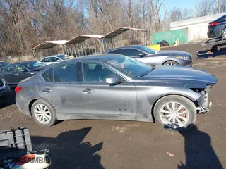 2015 Infiniti Q50 Premium with VIN JN1BV7AP4FM334762, listed as a IAAI auction lot 41443049 with 99,519 mi miles. Bid and sale history available at carsss.com. Image 14.