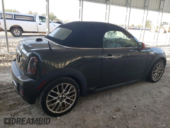 2015 MINI Roadster S z VIN WMWSY3C59FT566785, wystawiony jako Copart lot #73574064 z przebiegiem 96 623 mil mil oraz Tytuł czysty. Historia ofert i sprzedaży dostępna na DreamBid. Obrazek 3.