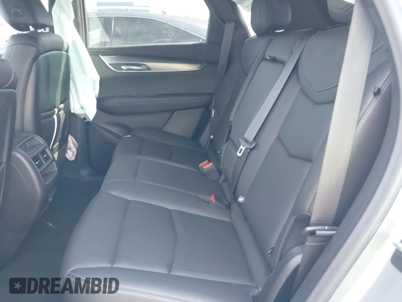2023 Cadillac XT5 FWD Luxury z VIN 1GYKNAR49PZ137556, wystawiony jako IAAI lot #41934199 z przebiegiem 13 298 mil mil oraz . Historia ofert i sprzedaży dostępna na DreamBid. Obrazek 8.