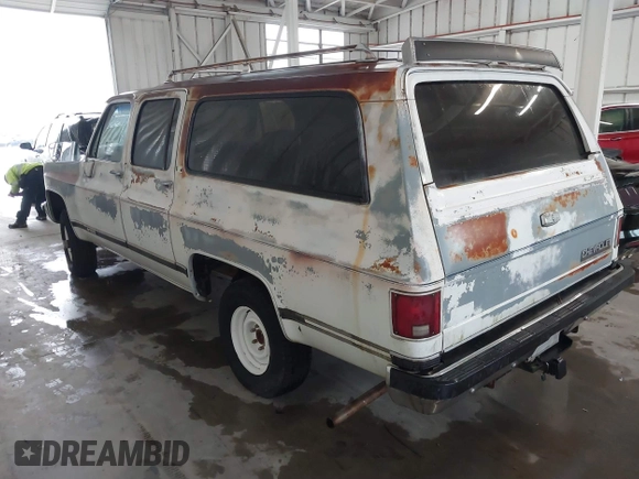 1989 Chevrolet Suburban z VIN 1GNEV16K2KF127586, wystawiony jako IAAI lot #41867659 z przebiegiem 71 373 mil mil oraz . Historia ofert i sprzedaży dostępna na DreamBid. Obrazek 3.