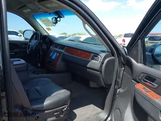 2012 Chevrolet Suburban LT with VIN 1GNSCJE00CR226285, listed as a IAAI auction lot 42059936 with 318,948 mi miles. Bid and sale history available at carsss.com. Image 5.