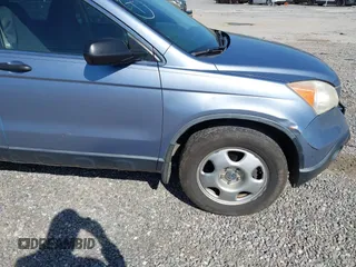 2007 Honda CR-V LX with VIN JHLRE38357C055256, listed as a IAAI auction lot 42050441 with 311,062 mi miles. Bid and sale history available at carsss.com. Image 12.