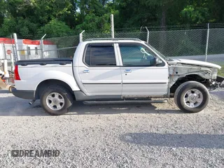 2003 Ford Explorer Sport Trac XLS z VIN 1FMZU77E33UA26042, wystawiony jako IAAI lot #42524905 z przebiegiem 124 878 mil mil oraz . Historia ofert i sprzedaży dostępna na DreamBid. Obrazek 13.