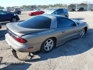 2000 Pontiac Firebird with VIN 2G2FS22K0Y2112410, listed as a IAAI auction lot 41676541 with 129,857 mi miles. Bid and sale history available at carsss.com. Image 4.