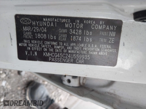 2004 Hyundai Accent GL z VIN KMHCG45C24U559935, wystawiony jako IAAI lot #40487927 z przebiegiem Nie podano mil oraz . Historia ofert i sprzedaży dostępna na DreamBid. Obrazek 9.