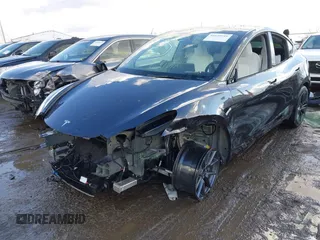 2024 Tesla Model Y Long Range with VIN 7SAYGDEE0RA300064, listed as a IAAI auction lot 41640541 with 5,049 mi miles and . Bid and sale history available at DreamBid. Image 2.