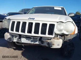 2009 Jeep Grand Cherokee Laredo with VIN 1J8GS48K29C518895, listed as a IAAI auction lot 41161045 with 153,499 mi miles. Bid and sale history available at carsss.com. Image 6.