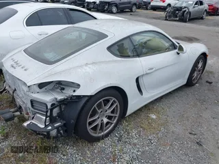 2016 Porsche Cayman with VIN WP0AA2A89GK171748, listed as a IAAI auction lot 41784245 with 70,686 mi miles and . Bid and sale history available at DreamBid. Image 4.