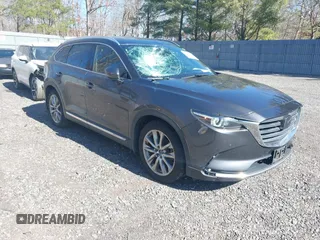 2019 Mazda CX-9 Grand Touring with VIN JM3TCBDY3K0307964, listed as a IAAI auction lot 41706594 with 170,596 mi miles and . Bid and sale history available at DreamBid. Image 1.
