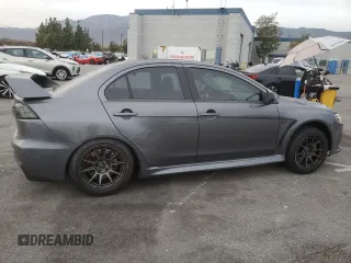 2010 Mitsubishi Lancer Evolution GSR with VIN JA32W8FV1AU027600, listed as a Copart auction lot 84328974 with 88,417 mi miles and Salvage Title. Bid and sale history available at DreamBid. Image 3.