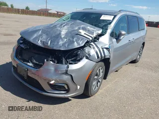 2021 Chrysler Pacifica Hybrid Touring L with VIN 2C4RC1L76MR594571, listed as a IAAI auction lot 40255745 with 58,163 mi miles and . Bid and sale history available at DreamBid. Image 18.