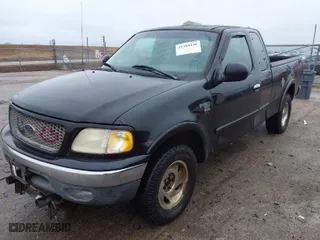 2000 Ford F-150 XL with VIN 1FTRX18LXYNA76850, listed as a IAAI auction lot 41384438 with 167,471 mi miles. Bid and sale history available at carsss.com. Image 2.