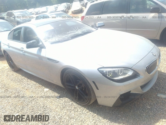 2015 BMW 6 Series 640i z VIN WBA6A0C57FGB53750, wystawiony jako IAAI lot #30357803 z przebiegiem 59 462 mil mil oraz . Historia ofert i sprzedaży dostępna na DreamBid. Obrazek 1.