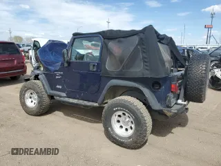 2002 Jeep Wrangler Sport z VIN 1J4FA49SX2P772609, wystawiony jako Copart lot #55893425 z przebiegiem 157 653 mil mil oraz Szkoda całkowita • Salvage title. Historia ofert i sprzedaży dostępna na DreamBid. Obrazek 2.