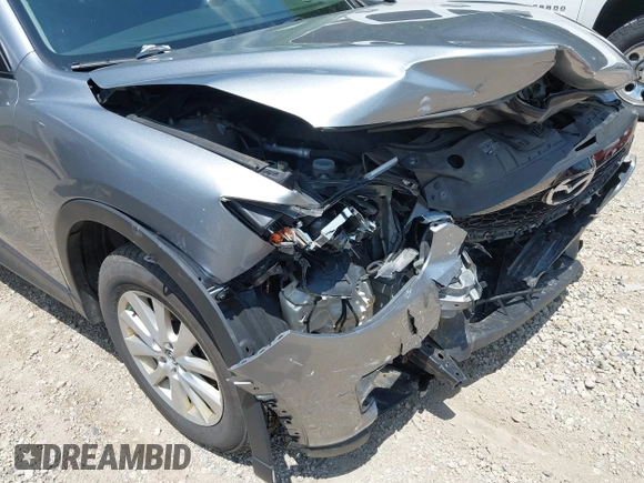 2014 Mazda CX-5 Sport with VIN JM3KE2BEXE0329303, listed as a IAAI auction lot 42556908 with 127,836 mi miles and . Bid and sale history available at DreamBid. Image 6.