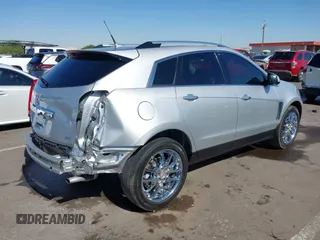 2013 Cadillac SRX Premium Collection z VIN 3GYFNEE36DS556446, wystawiony jako IAAI lot #42289824 z przebiegiem 23 988 mil mil oraz . Historia ofert i sprzedaży dostępna na DreamBid. Obrazek 4.