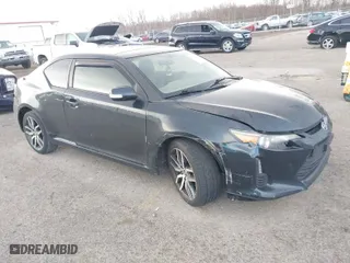 2015 Scion tC with VIN JTKJF5C7XFJ001662, listed as a IAAI auction lot 41843123 with 128,851 mi miles. Bid and sale history available at carsss.com. Image 1.