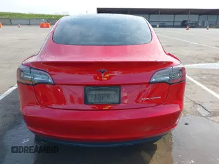 2021 Tesla Model 3 Long Range with VIN 5YJ3E1EB2MF015279, listed as a IAAI auction lot 41765428 with 55,486 mi miles. Bid and sale history available at carsss.com. Image 16.