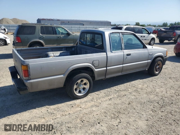 1993 Mazda B-Series Truck z VIN JM2UF3130P0378304, wystawiony jako Copart lot #58799925 z przebiegiem 132 801 mil mil oraz Szkoda całkowita • Salvage title. Historia ofert i sprzedaży dostępna na DreamBid. Obrazek 3.