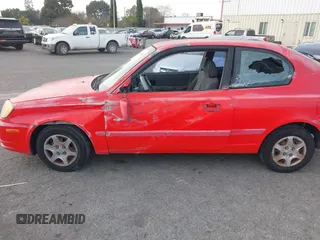 2003 Hyundai Accent GL with VIN KMHCG35C23U238969, listed as a IAAI auction lot 41462884 with 156,682 mi miles. Bid and sale history available at carsss.com. Image 6.