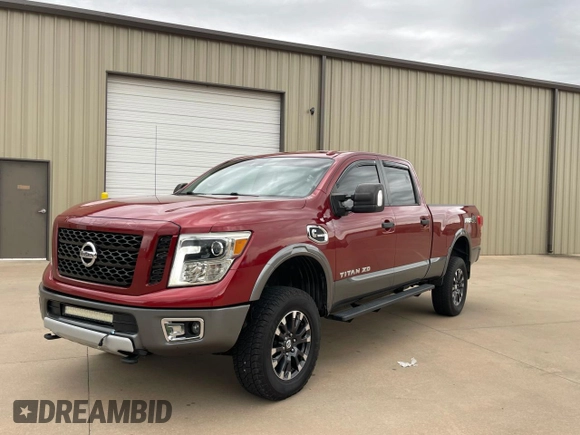 2016 Nissan Titan Pro-4X z VIN 1N6BA1F40GN516889, wystawiony jako Copart lot #72827234 z przebiegiem 123 706 mil mil oraz Czysty tytuł • Clean title. Historia ofert i sprzedaży dostępna na DreamBid. Obrazek 2.