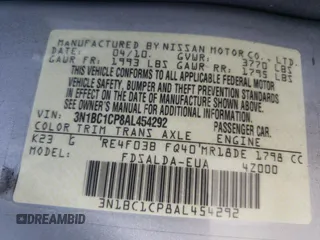 2010 Nissan Versa S z VIN 3N1BC1CP8AL454292, wystawiony jako Copart lot #55031695 z przebiegiem 119 095 mil mil oraz Szkoda całkowita • Salvage title. Historia ofert i sprzedaży dostępna na DreamBid. Obrazek 13.