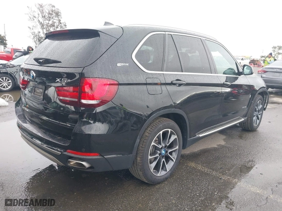 2018 BMW X5 xDrive40e iPerformance with VIN 5UXKT0C54J0V99573, listed as a IAAI auction lot 41490567 with 50,650 mi miles. Bid and sale history available at carsss.com. Image 4.