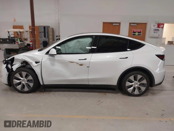 2022 Tesla Model Y Long Range z VIN 7SAYGDEE3NF358487, wystawiony jako IAAI lot #42036969 z przebiegiem 52 723 mil mil oraz . Historia ofert i sprzedaży dostępna na DreamBid. Obrazek 14.
