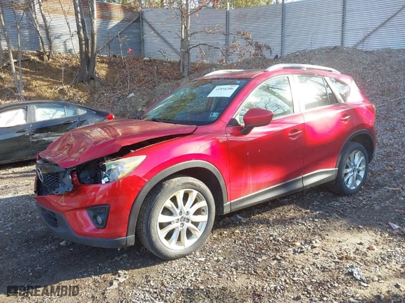 2014 Mazda CX-5 Grand Touring with VIN JM3KE2DY1E0380423, listed as a IAAI auction lot 41854206 with 129,763 mi miles. Bid and sale history available at carsss.com. Image 2.
