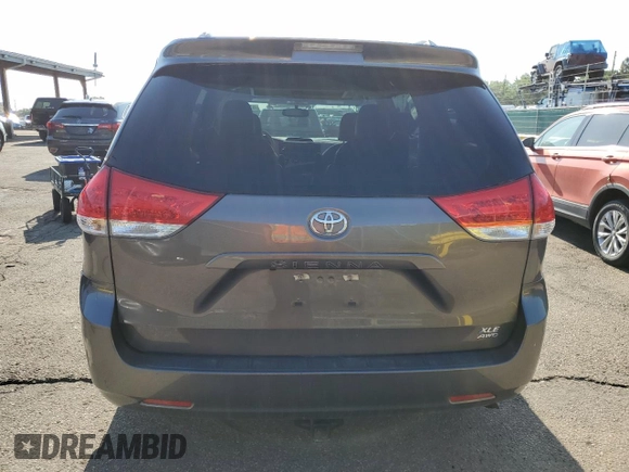 2014 Toyota Sienna Limited with VIN 5TDDK3DC8ES078175, listed as a Copart auction lot 61138585 with 98,527 mi miles and Salvage title. Bid and sale history available at DreamBid. Image 6.
