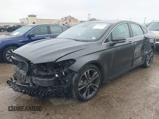 2020 Ford Fusion Titanium with VIN 3FA6P0K97LR192657, listed as a IAAI auction lot 42170258 with 87,696 mi miles and . Bid and sale history available at DreamBid. Image 2.
