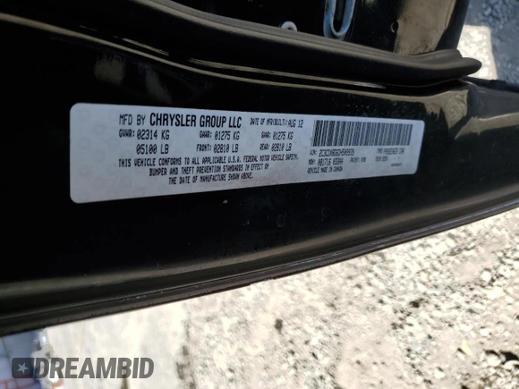 2013 Dodge Charger SE z VIN 2C3CDXBG6DH509939, wystawiony jako Copart lot #57851415 z przebiegiem 182 634 mil mil oraz Szkody całkowita. Historia ofert i sprzedaży dostępna na DreamBid. Obrazek 12.