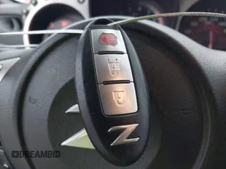 2016 Nissan 370Z z VIN JN1AZ4EHXGM932681, wystawiony jako IAAI lot #42350850 z przebiegiem 94 586 mil mil oraz . Historia ofert i sprzedaży dostępna na DreamBid. Obrazek 11.