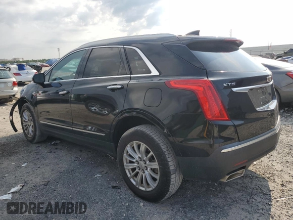 2017 Cadillac XT5 FWD with VIN 1GYKNARS0HZ283618, listed as a Copart auction lot 61640005 with 113,823 mi miles and Salvage title. Bid and sale history available at DreamBid. Image 2.