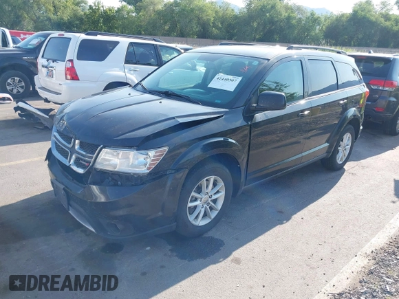 2013 Dodge Journey SXT with VIN 3C4PDDBG1DT606887, listed as a IAAI auction lot 42440507 with 250,836 mi miles and . Bid and sale history available at DreamBid. Image 2.