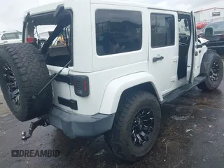 2016 Jeep Wrangler Unlimited Rubicon Hard Rock with VIN 1C4BJWFG3GL228449, listed as a IAAI auction lot 42158318 with Not provided miles and . Bid and sale history available at DreamBid. Image 4.