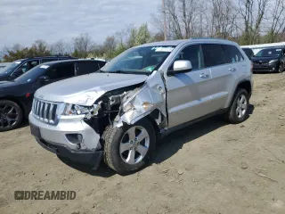 2012 Jeep Grand Cherokee Laredo with VIN 1C4RJFAG4CC123354, listed as a Copart auction lot 52711295 with 151,004 mi miles and Salvage Title. Bid and sale history available at carsss.com. Image 1.