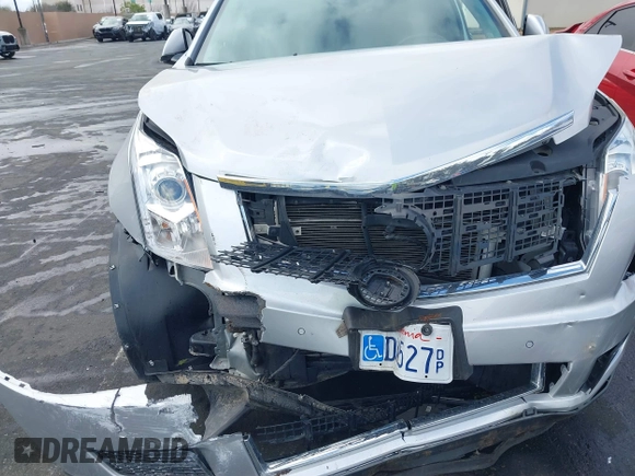 2016 Cadillac SRX Luxury Collection z VIN 3GYFNBE38GS520891, wystawiony jako IAAI lot #41781445 z przebiegiem 52 202 mil mil oraz . Historia ofert i sprzedaży dostępna na DreamBid. Obrazek 6.