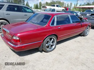 1998 Jaguar XJ Vanden Plas with VIN SAJKX6249WC844067, listed as a IAAI auction lot 42145235 with 117,142 mi miles and . Bid and sale history available at DreamBid. Image 4.