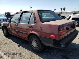 1986 Toyota Corolla with VIN JT2AE82EXG3386120, listed as a Copart auction lot 59397245 with 276,586 mi miles and Salvage title. Bid and sale history available at DreamBid. Image 2.