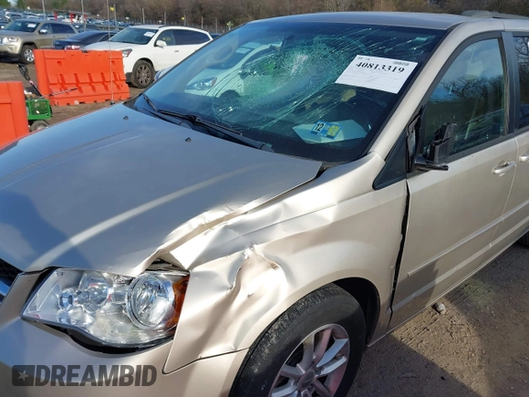 2014 Dodge Grand Caravan SXT with VIN 2C4RDGCG0ER210186, listed as a IAAI auction lot 40813319 with 100,230 mi miles and . Bid and sale history available at DreamBid. Image 6.
