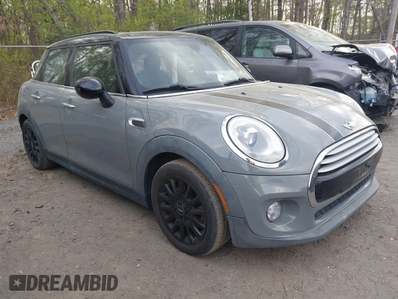 2015 MINI Hardtop 4 Door with VIN WMWXS5C57FT831660, listed as a IAAI auction lot 42057682 with 110,940 mi miles and . Bid and sale history available at DreamBid. Image 1.