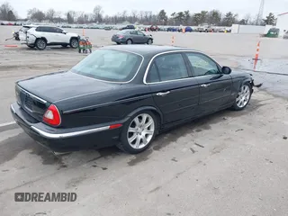 2004 Jaguar XJ with VIN SAJWA71C14SG20122, listed as a IAAI auction lot 41685767 with 113,392 mi miles. Bid and sale history available at carsss.com. Image 4.