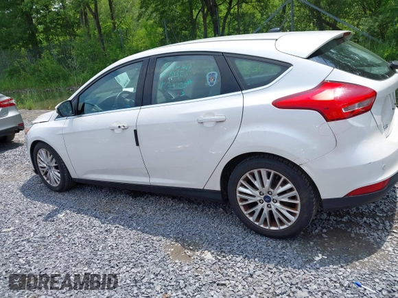 2016 Ford Focus Titanium with VIN 1FADP3N26GL332709, listed as a IAAI auction lot 42458997 with 75,509 mi miles and . Bid and sale history available at DreamBid. Image 14.