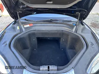 2013 Tesla Model S with VIN 5YJSA1DN8DFP17027, listed as a IAAI auction lot 42168317 with 148,394 mi miles. Bid and sale history available at carsss.com. Image 10.