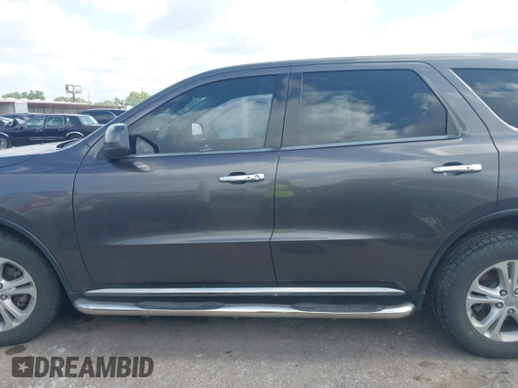 2013 Dodge Durango SXT with VIN 1C4RDHAG4DC686389, listed as a IAAI auction lot 42440260 with 166,952 mi miles and . Bid and sale history available at DreamBid. Image 14.
