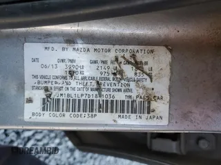 2013 Mazda 3 i Touring z VIN JM1BL1LP7D1841036, wystawiony jako Copart lot #53365045 z przebiegiem 166 539 mil mil oraz Szkoda całkowita • Salvage title. Historia ofert i sprzedaży dostępna na DreamBid. Obrazek 14.
