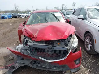 2014 Mazda CX-5 Touring with VIN JM3KE2CY4E0411780, listed as a IAAI auction lot 41903570 with 103,658 mi miles and . Bid and sale history available at DreamBid. Image 12.