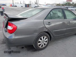 2004 Toyota Camry LE with VIN 4T1BF32K84U588764, listed as a IAAI auction lot 42126345 with 144,642 mi miles. Bid and sale history available at carsss.com. Image 6.